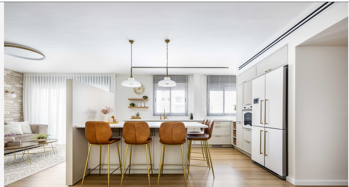 Kitchen with a partition wall, breakfast bar and leather stools
